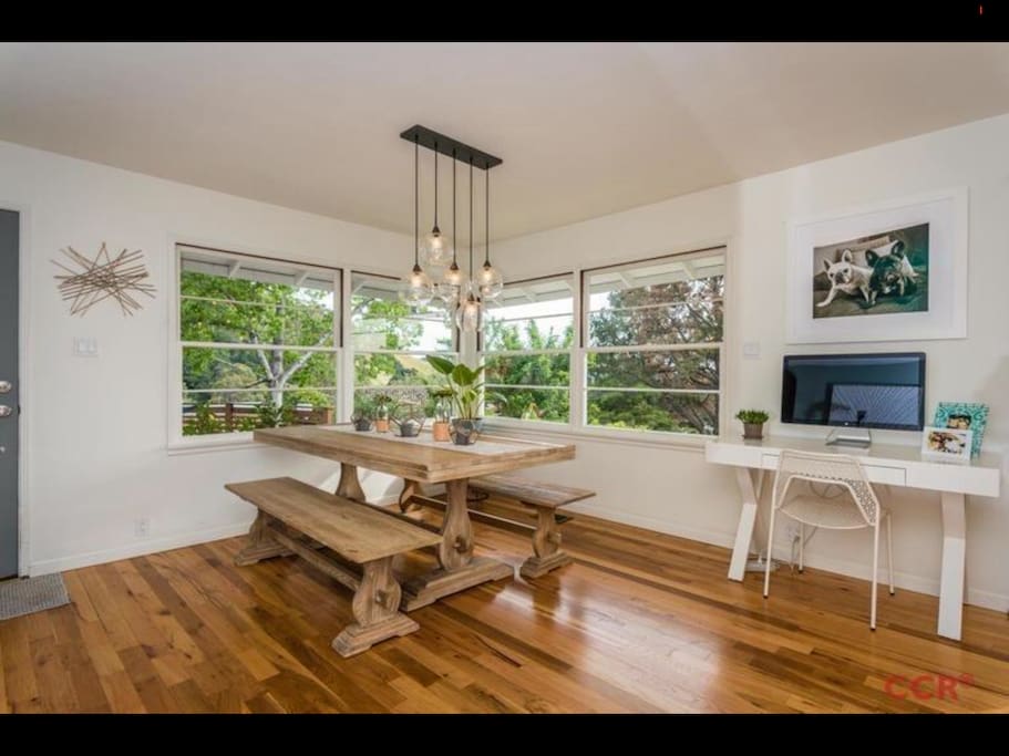 House has tons of Windows giving it a treehouse-like feel.
