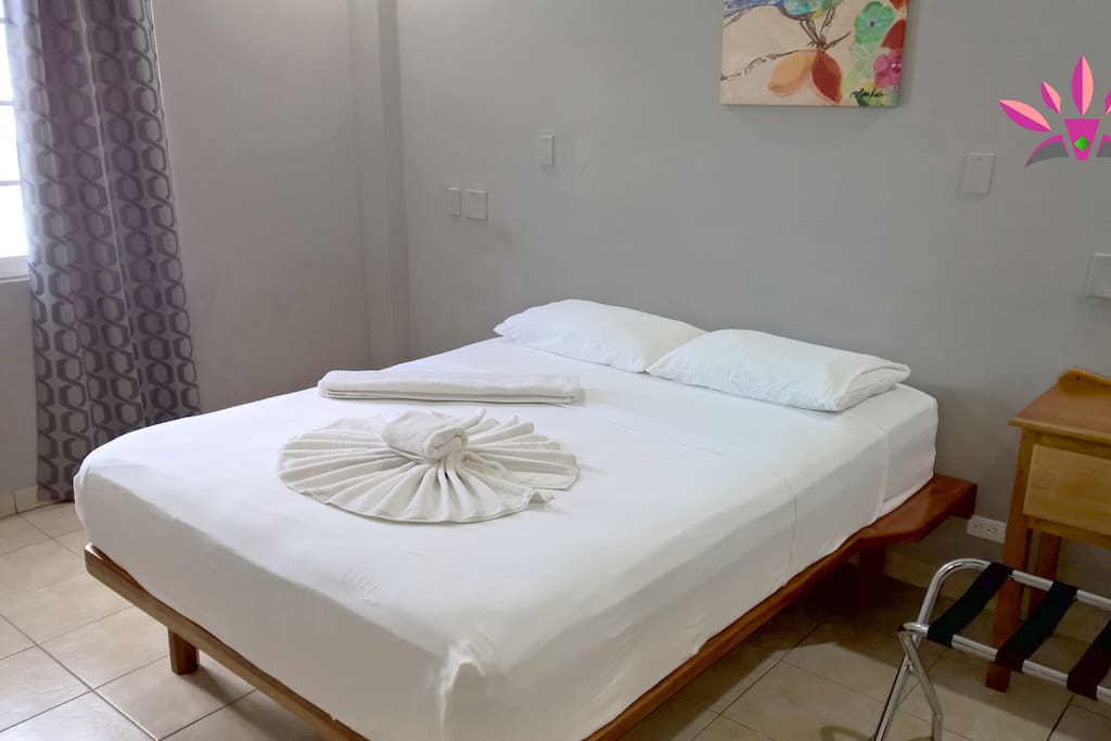 Bigger bedroom with a couch and more.