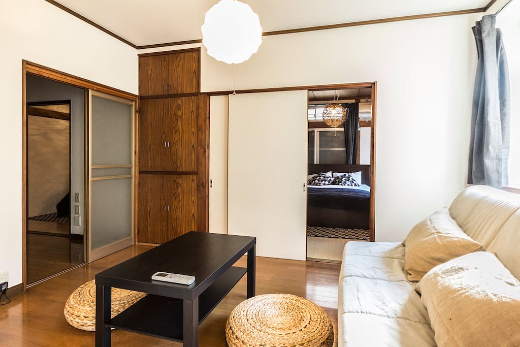 Living room with the view into the main bedroom and into the dining area