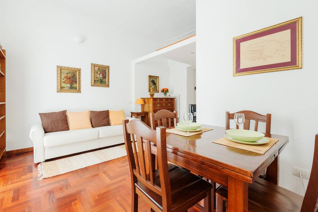 The living room (sofa bed x2) & the dining table