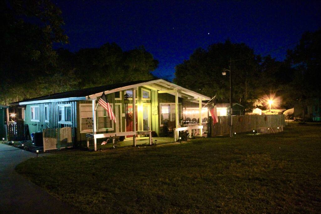 Front of Home lit up at night. Rocker on the Front Porch for Star Gazing and Wild Life