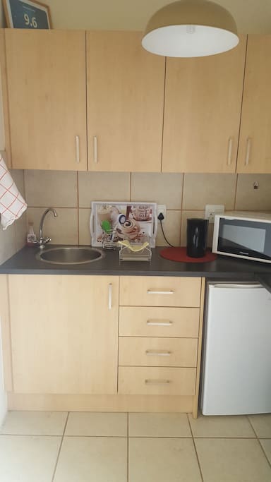 kitchen fully equipped with cutlery and crockery