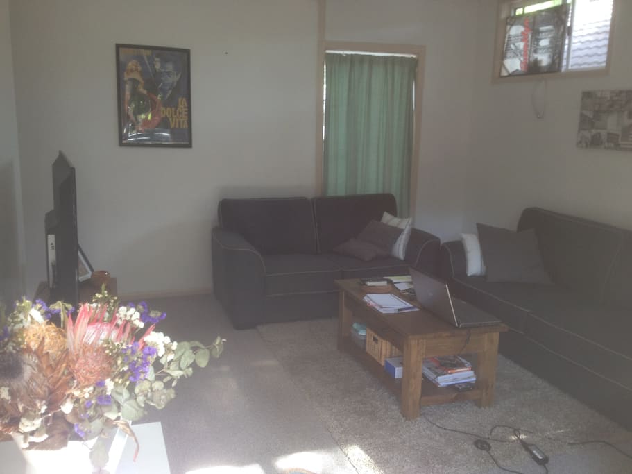 comfy sitting room area with big tv