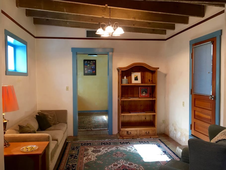 West half of the great room with kitchen beyond