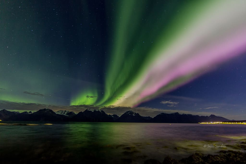 Northern lights above the Lyngen Alps, seen from the boat house belonging to the property. October 2016.