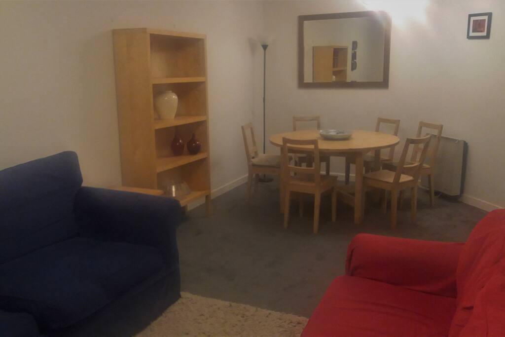 Large living/dining room with sofa bed