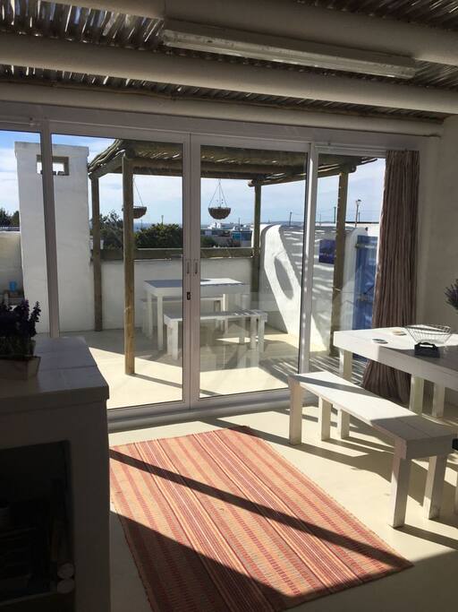 Spacious sitting area and patio overlooking the sea