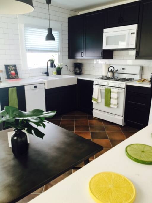 Bright new kitchen with new appliances and kitchen nook.