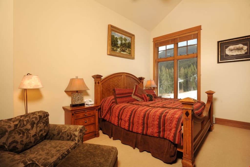 The master bedroom features a comfortable queen bed
