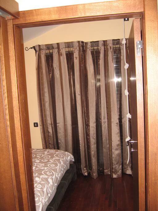 Beedroom with balcony street view