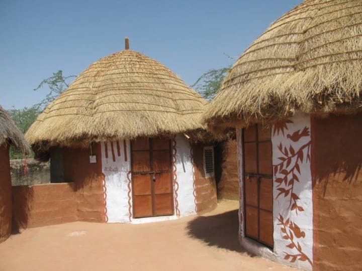 This unique accommodation  consists of 7 (?) individual mud huts attached western bathroom.