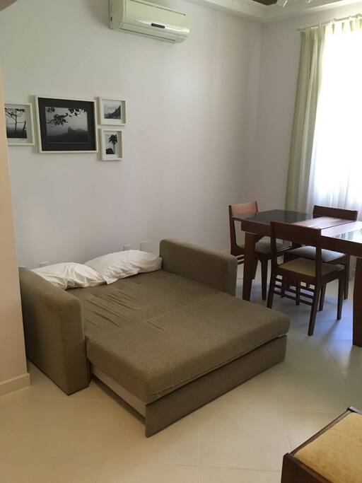 Living room - opened sofa-bed | Sala com sofá-cama aberto