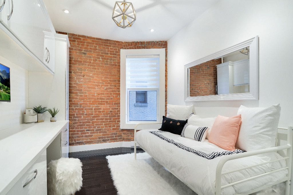 Bedroom with double closets, plush twin bed and extra mattress for second guest
