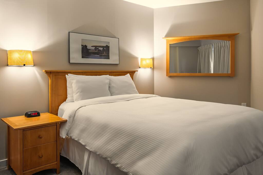 There's a queen bed in the first bedroom.