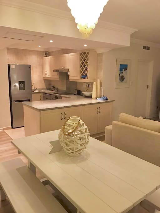 Dining room with the open plan kitchen.