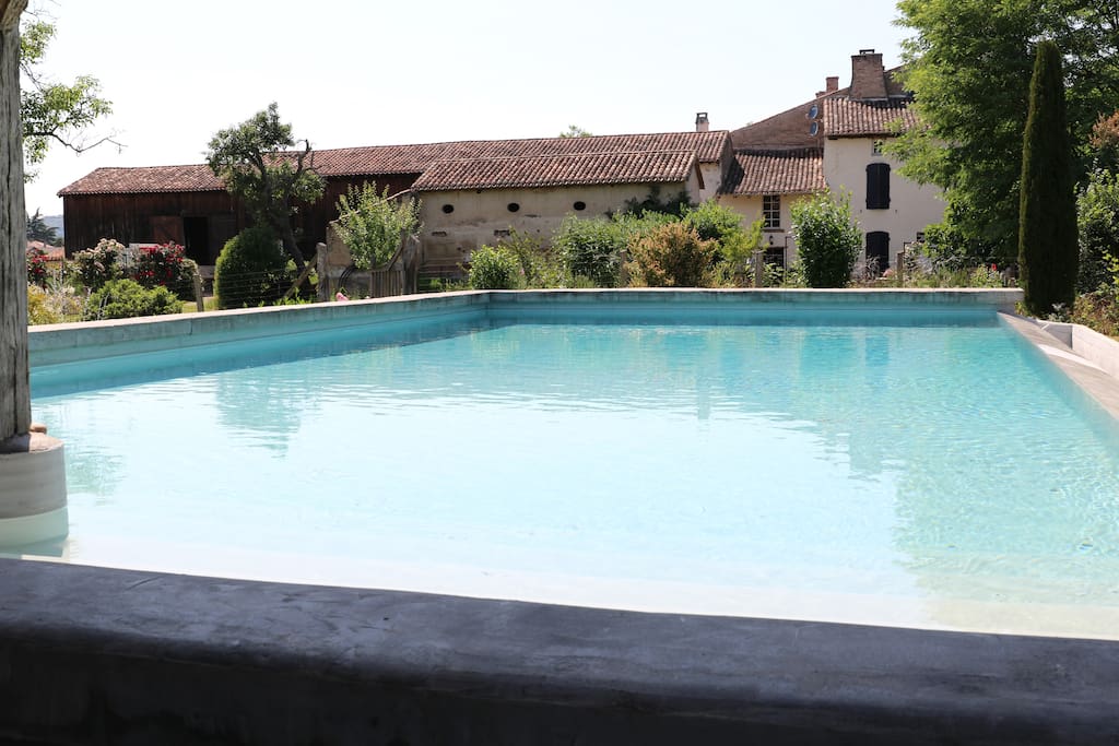 Infinity pool; view of Les Séchoirs from the sun decking / shaded terrace