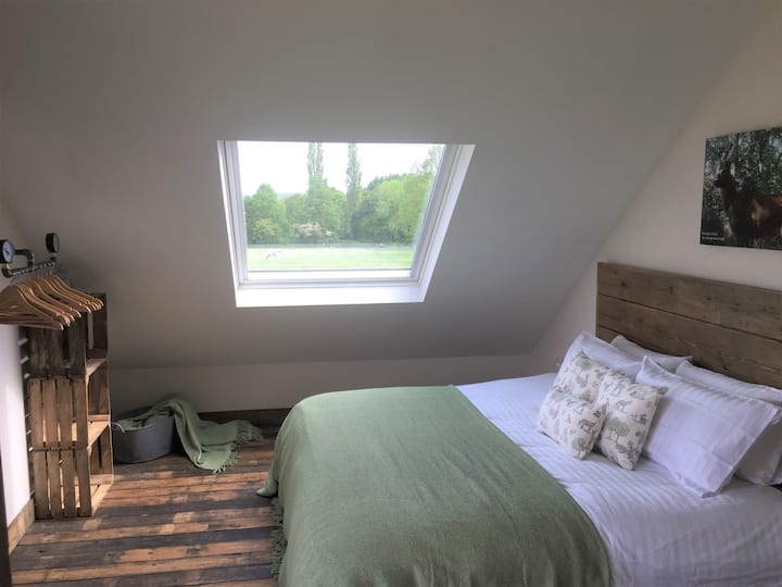 Bedroom 1 is spacious and has beautiful countryside views from 2 windows