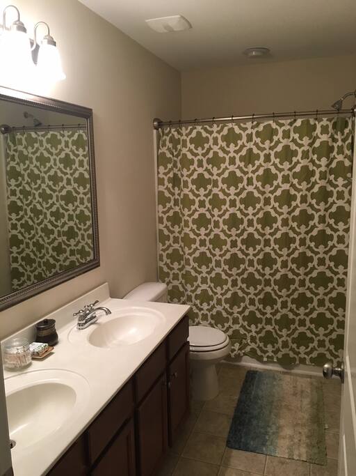 Private bathroom with towels, body wash, shampoo/conditioner.