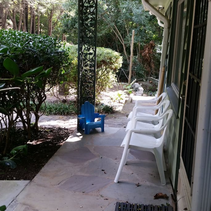 The front porch has seating for visiting.