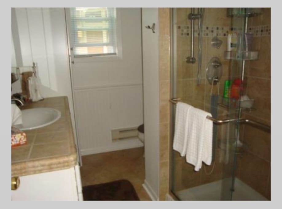 Beautifully updated bathroom with dual head shower, all towels provided.