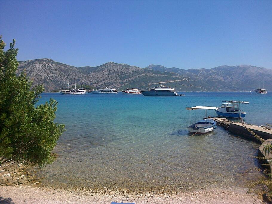 Beach infront of the house and megayachts