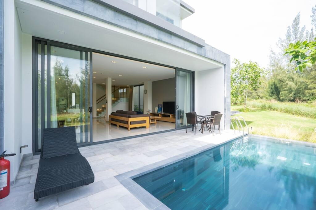 Swimming pool with sun chair and coffee table