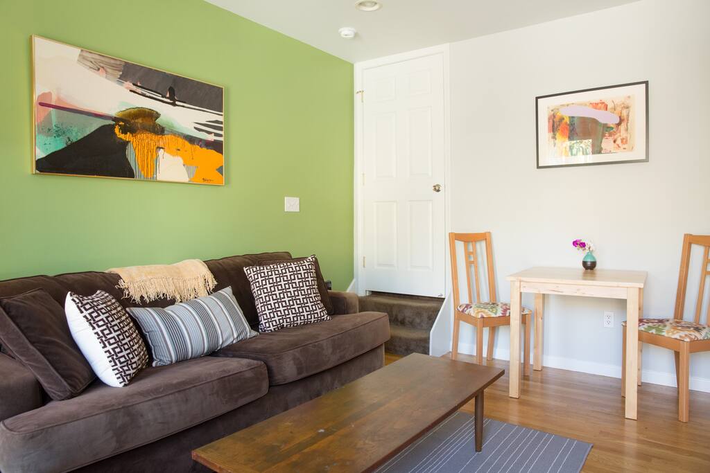 Living room is open for relaxing and eating.