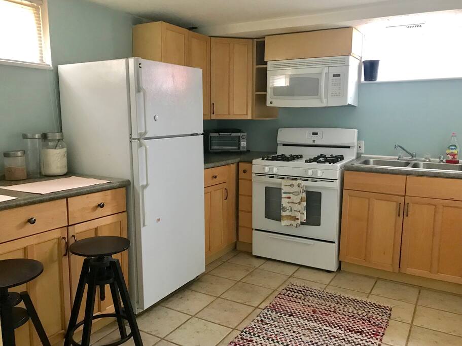 Full-sized kitchen with the works... cooking ware, snacks, toaster, etc. Double sink even has a dispose-all.