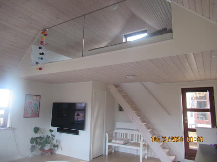 View of the stairs to the loft sleeping space.