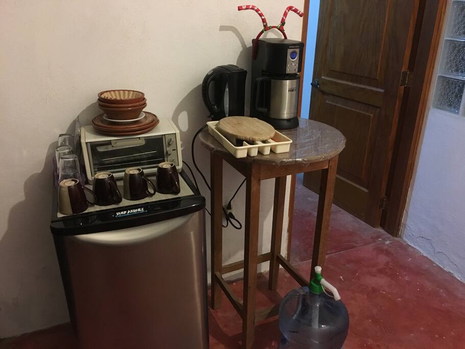Toaster oven, drinking water, teapot. Tea provided but not coffee. French press available upon request.