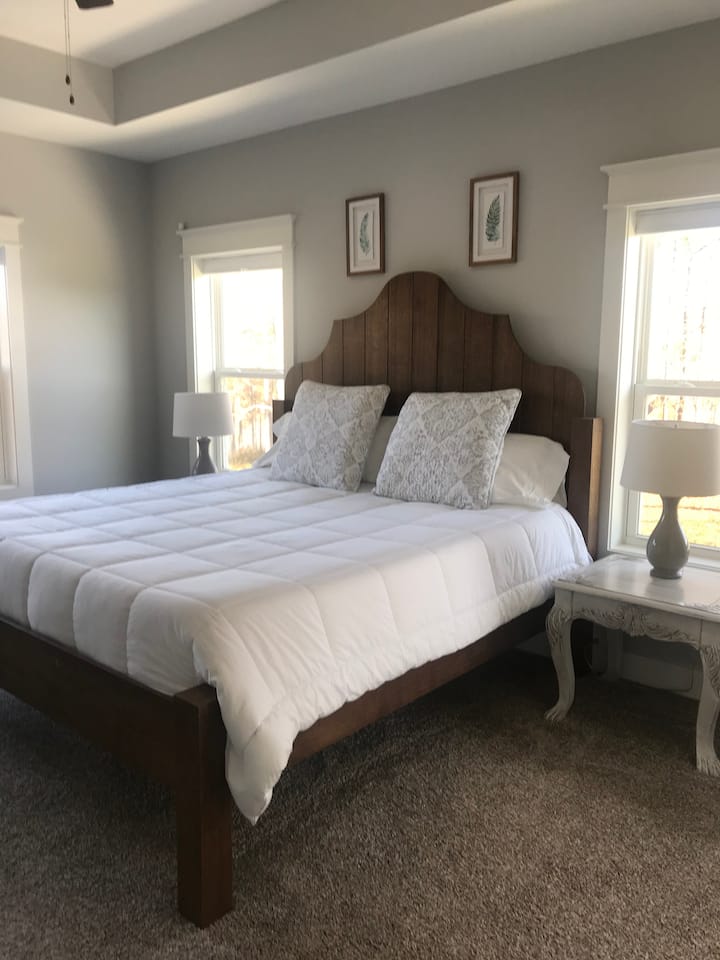 Sleep comfortably in the Master Bedroom with our premium king size Purple Mattress bed.   This piece was designed and hand crafted by the owners from solid red oak.