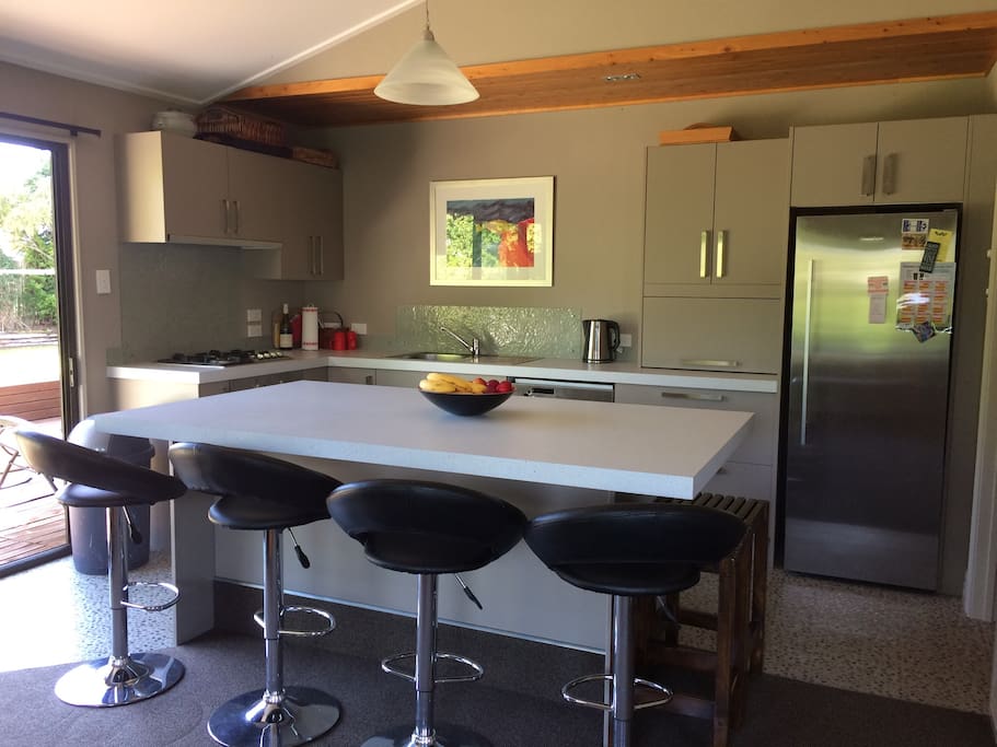 Modern kitchen with all the essentials, gas cooktop/full fridge/dishwasher