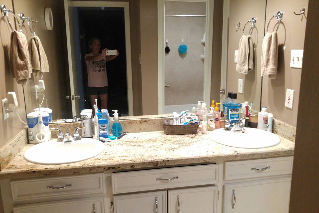 guest bath has double sinks. Guests get their own sink. Toilet and shower are closed off