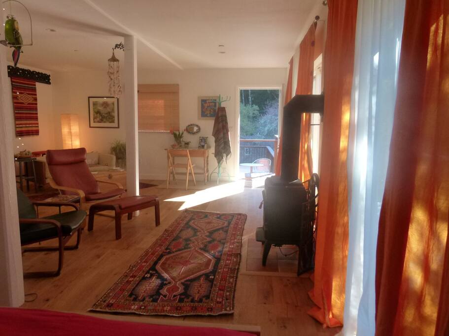 From the bedroom nook, view the forest trees on the front deck.