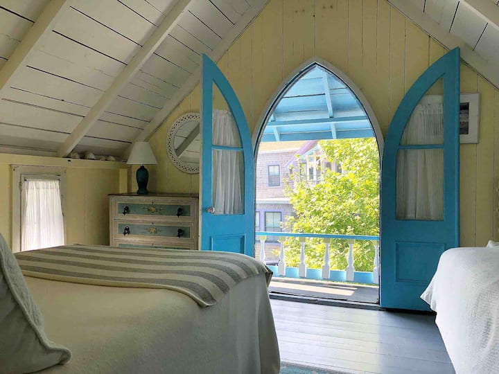 Master bedroom with beautiful original Gothic style windows. Sleeps three.