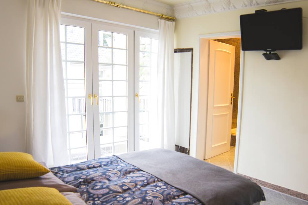 bedroom 1 with TV, own bathroom 1, small working corner, wardrobe