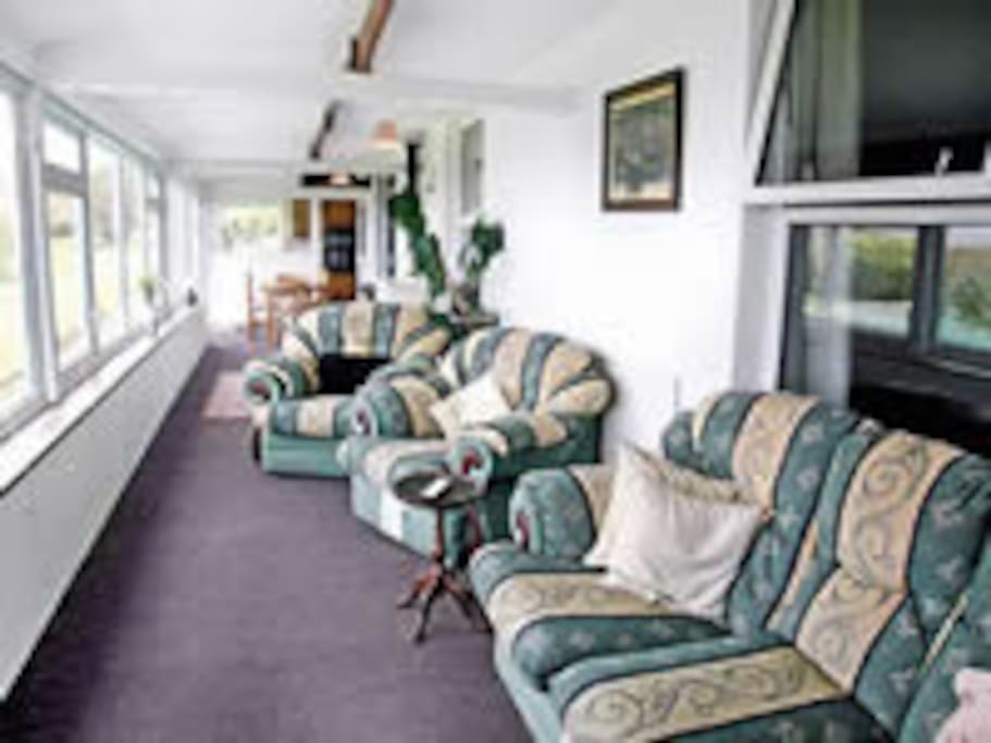 large shared conservatory with excellent countryside views to sea