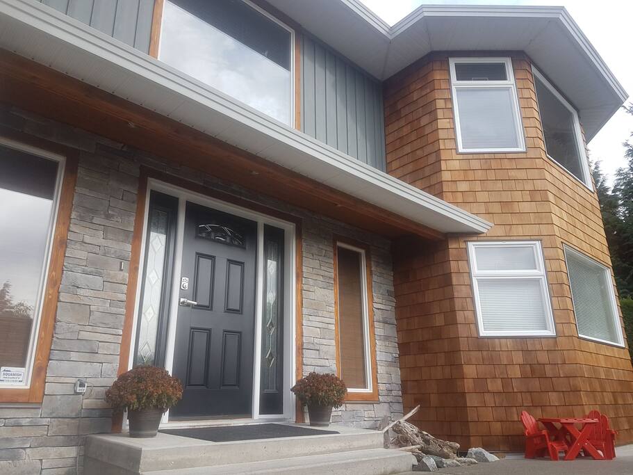 Beautiful custom stonework and cedar shake siding complement our natural surroundings