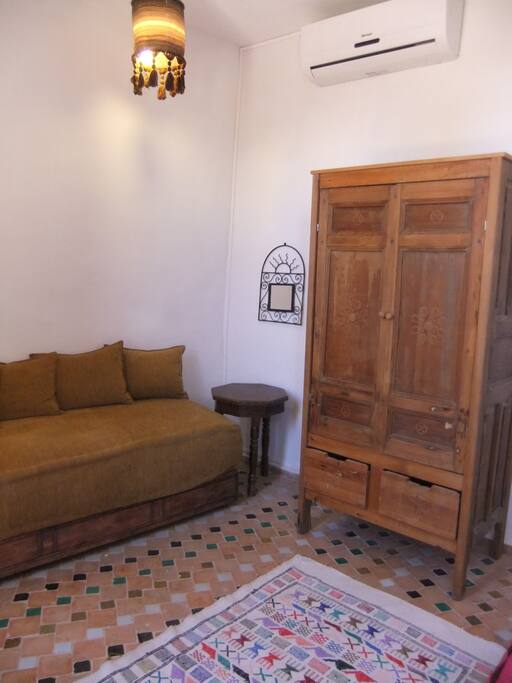Wardrobe and sofa in bedroom