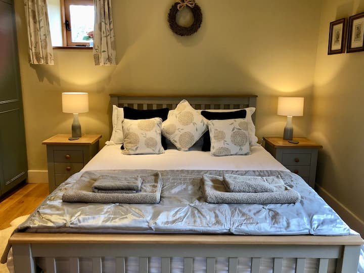 The bedroom with a king size bed and Egyptian Cotton bed linen - a haven of peace and comfort….