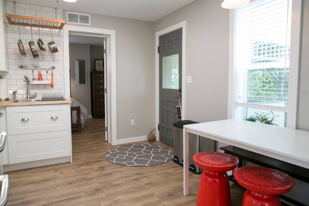 View of front door from the living room. Table seats 4 comfortably
