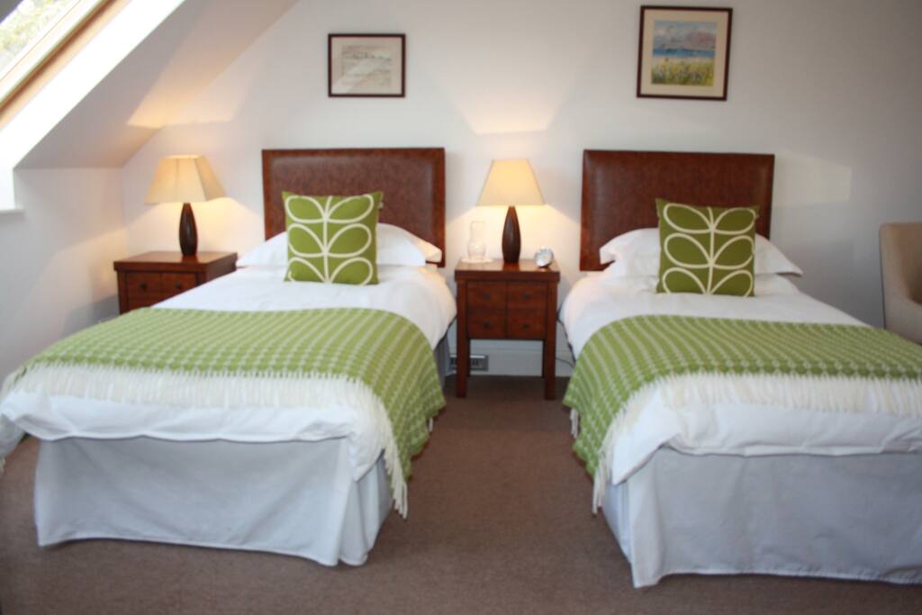 The Scott guest room with cozy blankets and silky soft linen to help waft you to sleep