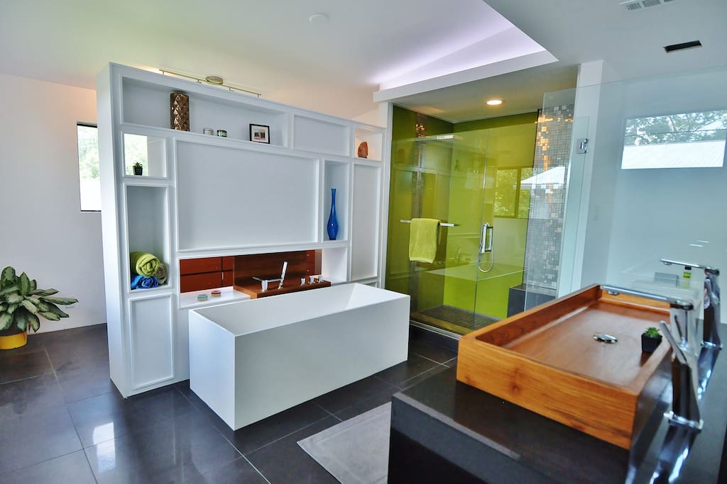 Amazing rain shower, teak accents, your own spa retreat awaits!