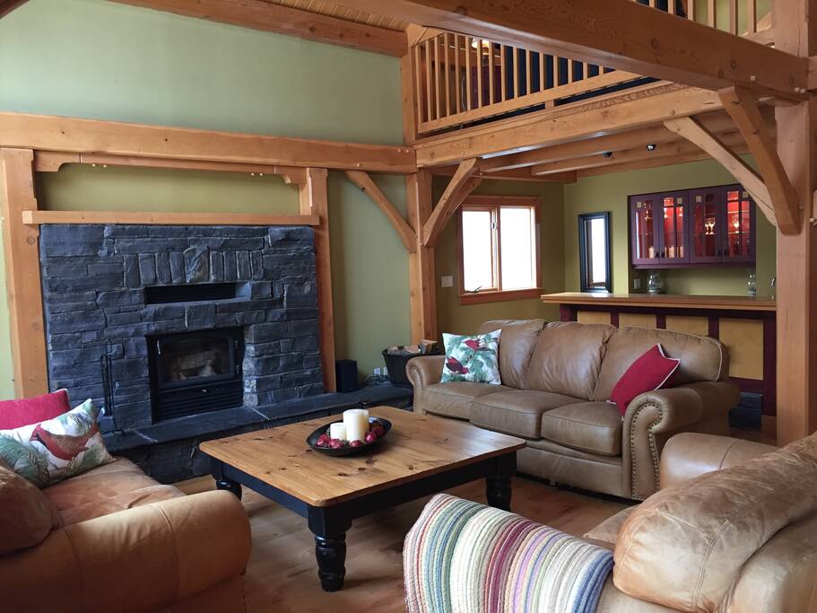 Living room with wood burning fireplace. Light the candles and curl up and relax at the end of your day.