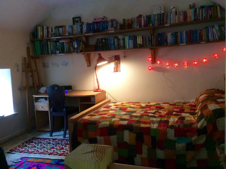 The bedroom has a desk, plenty of books and an Internet connection.