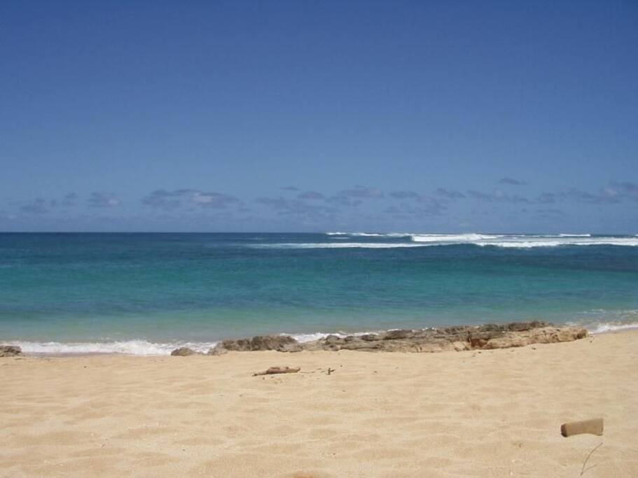 Beach at V-land; A short six minute walk to soft pebble sand