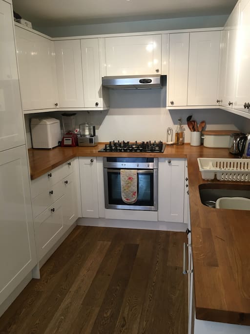Well equiped kitchen with large built in fridge and freezer, dishwasher and gas hob with electric fan oven.