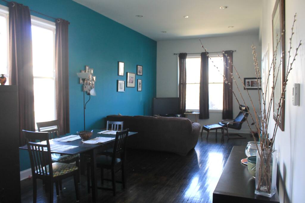 Our sunlit open concept dining room and living room.