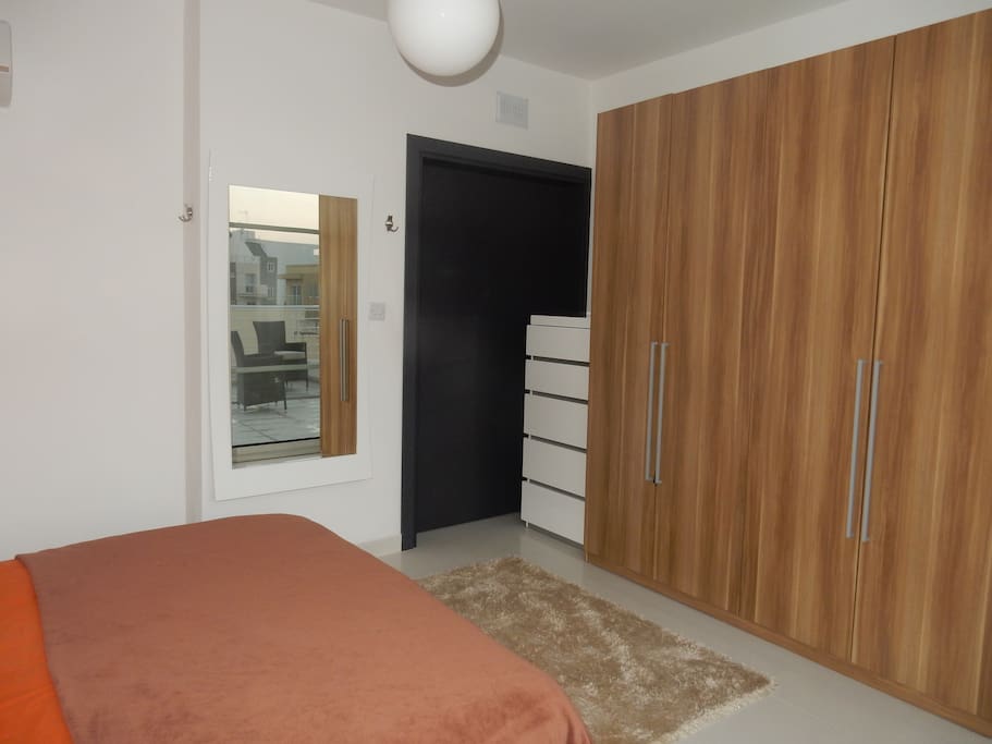 Main bedroom, large wardrobe, chest of drawers and large mirror