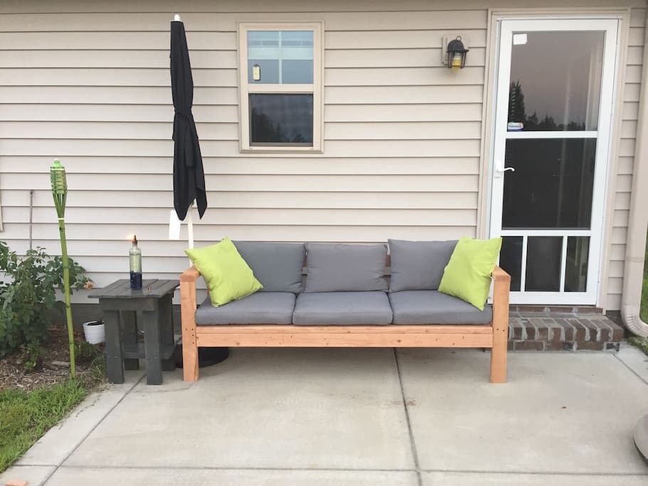 Hand made outdoor sofa. Come enjoy the backyard!